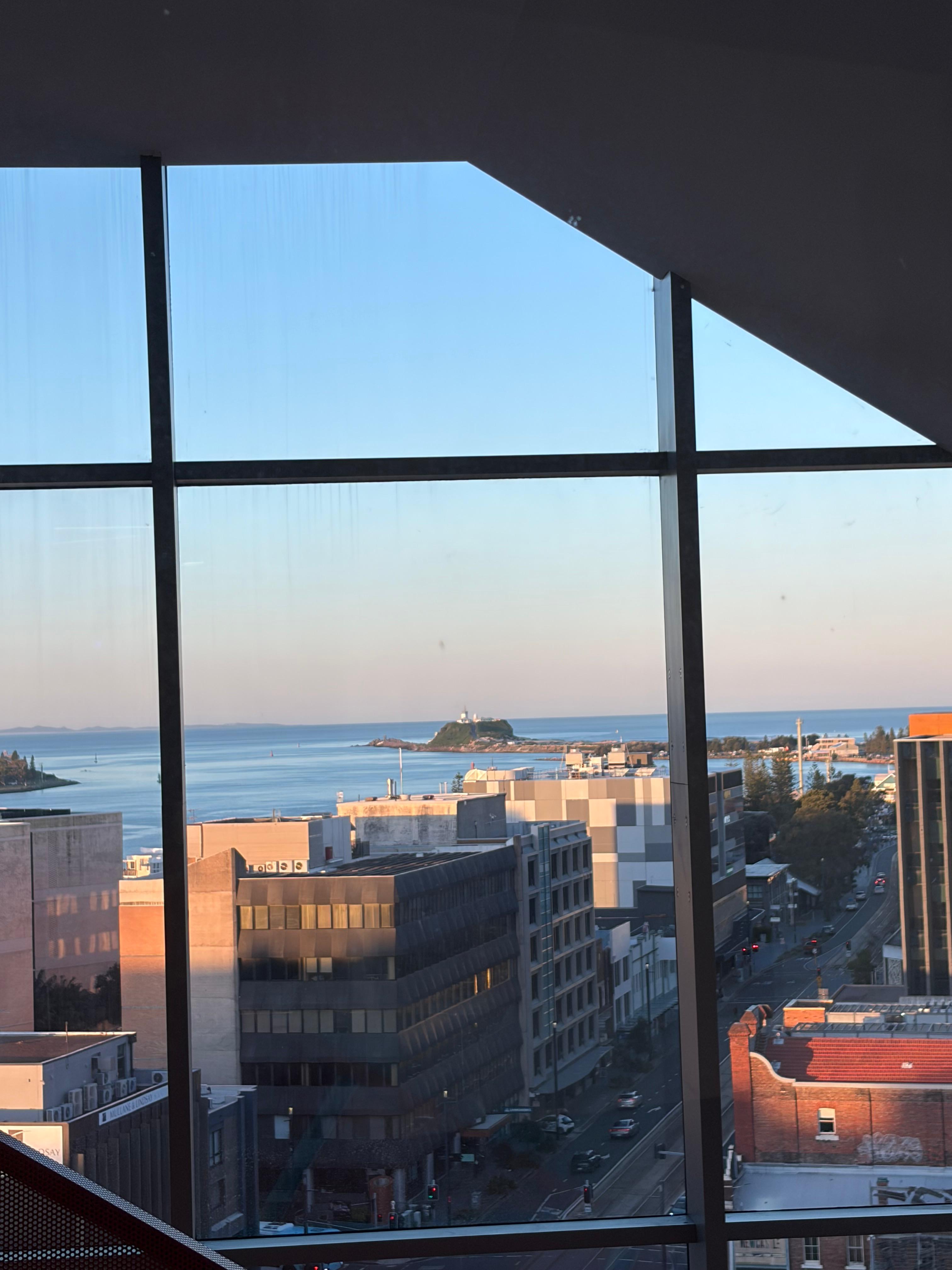The view over Newcastle harbour from a window at first light